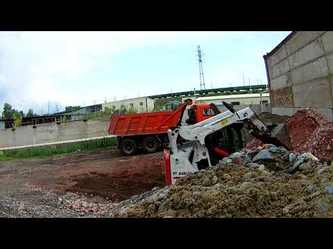 Видео: bobcat s 570  погрузка КамАЗа 65115 на 1700оборотов