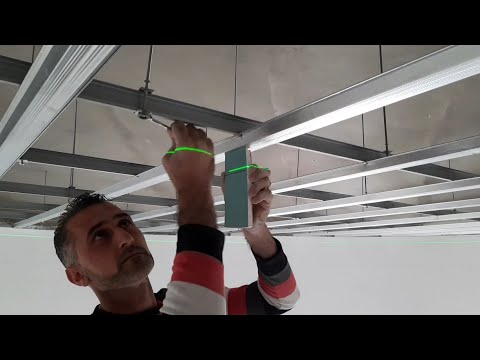 Видео: Как установить железный потолок из гипсокартона