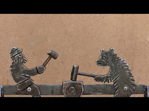 Видео: "Кузнец и медведь" из металла
