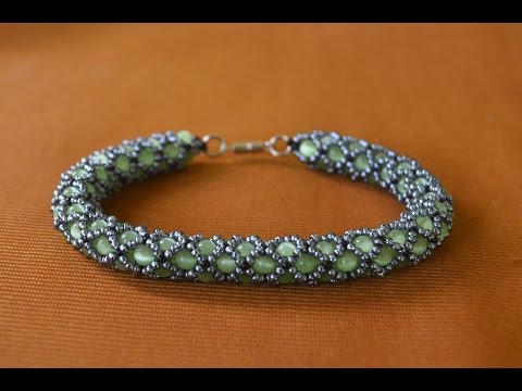 Видео: Браслет из бисера.  Ажурный жгут.  Бисероплетение.  Мастер класс