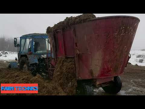 Видео: Работа тракторов в хозяйстве. Приготовление и раздача кормов.