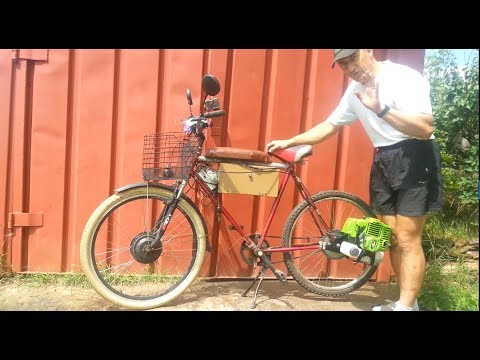 Видео: Сборка мотовелосипеда с двигателем мотокосы, полная инструкция