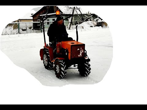 Видео: Минитрактор чистка снега  5мин.