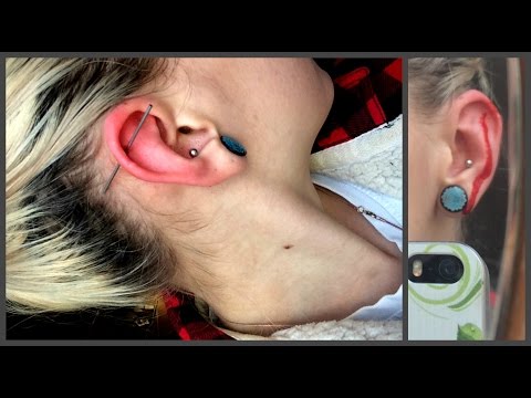 Видео: Прокол хряща уха дома/пирсинг уха дома