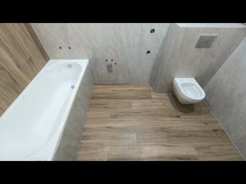 Видео: Укладка плитки в санузле.