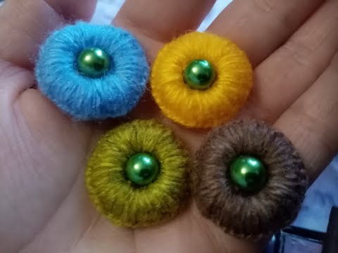 Видео: Как сделать пуговицу из ниток с помощью иглы.