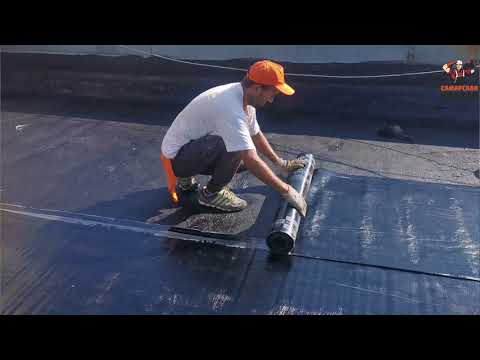 Видео: Наплавление первого и второго слоя рулонного кровельного материала «Армокров»