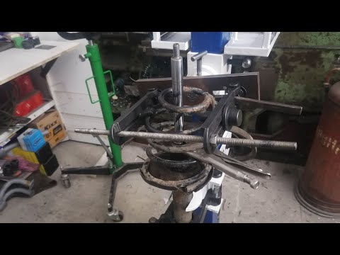 Видео: Стяжка пружин исправления.