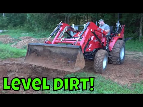 Видео: Как выровнять землю с помощью тракторного погрузчика