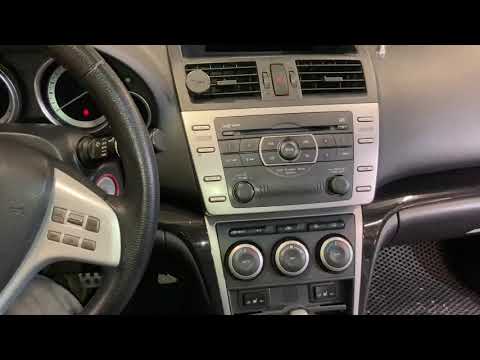 Видео: Мазда 6 как снять штатную магнитолу