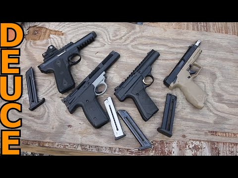 Видео: Пистолеты Ruger против S&W против Browning против Taurus 22 на стрельбище