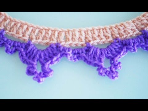 Видео: Кайма крючком поворотными рядами