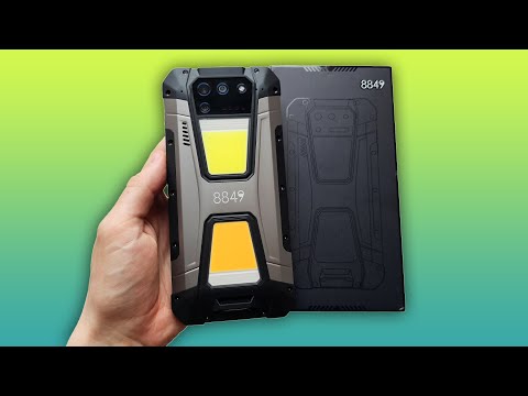 Видео: UNIHERTZ TANK 2 - ТЕЛЕФОН С ПРОЕКТОРОМ И 2 МОЩНЫМИ ЛАМПАМИ!