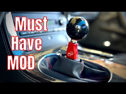 Видео: Лучший короткоходный рычаг переключения передач для Corvette C6 | Установка плоской ручки MGW