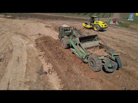 Видео: Работа скреперов на строительстве пруда