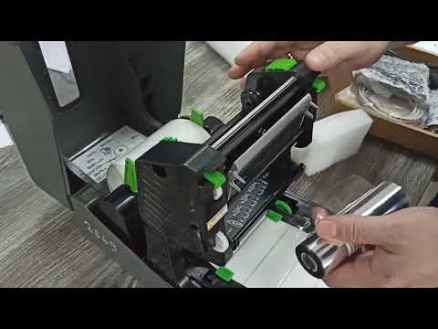 Видео: Заправка принтера риббоном и бумагой TSC TC200