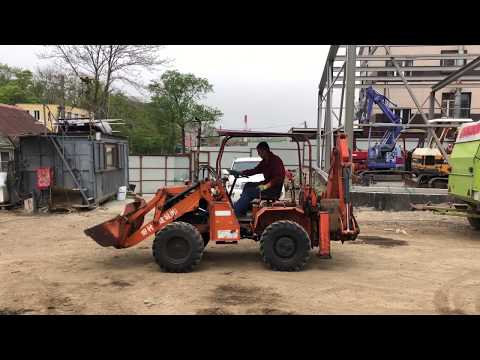 Видео: Видео работы! Фронтальный погрузчик с экскаватором KUBOTA RW25