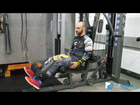 Видео: Разгибание ног в тренажере сидя - ошибки в упражнении и техника выполнения