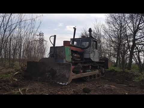 Видео: Т150 XTZ Бульдозер гусеничный ямз 236 ремонт старой дороги bulldozer T-150 uproots and makes a road