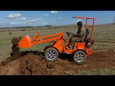 Видео: Минипогрузчик. Плуг. Роторная косилка. Ямобур.