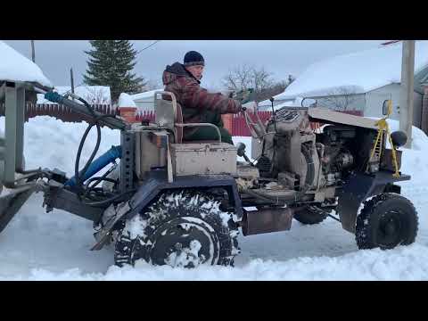Видео: Борьба со снегом после оттепели на самодельном тракторе.