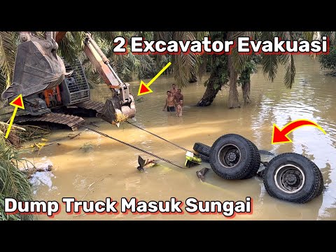 Видео: 2. Экскаватор эвакуирует самосвал, въезжающий в реку