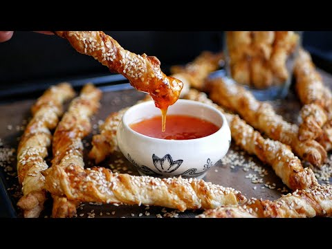 Видео: СУПЕР Закуска! СЫРНЫЕ ПАЛОЧКИ С КУНЖУТОМ | Выпечка из слоеного теста