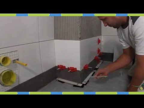 Видео: Укладка плитки для ванной, сверление отверстий в плитке, обработка кромок плитки