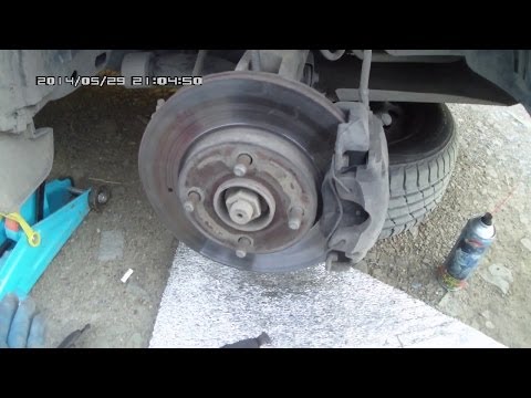 Видео: Замена передних колодок на Ford Fusion