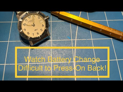 Видео: Успешная замена батареи - нажимная задняя часть - Raymond Weil W1.