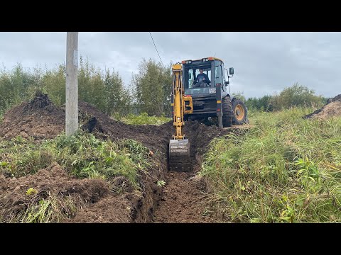 Видео: Экскаватор LiuGong 777 A-S - расчищаем китайцем дренажную канаву и делаем заезд на участок.