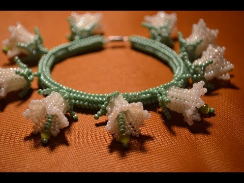 Видео: Браслет из бисера.  Набор "Лилии".  Бисероплетение.  Мастер класс