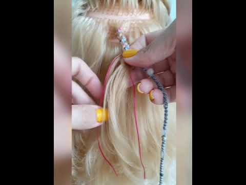 Видео: Как вплести лулу в волосы
