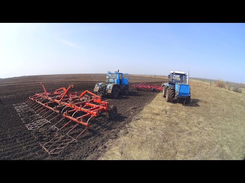Видео: Культивация на трёх ХТЗ. Распоротое колеса культиватора КТП-7.4.