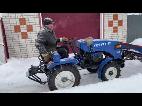 Видео: Минитрактор Garden Scout против снега.