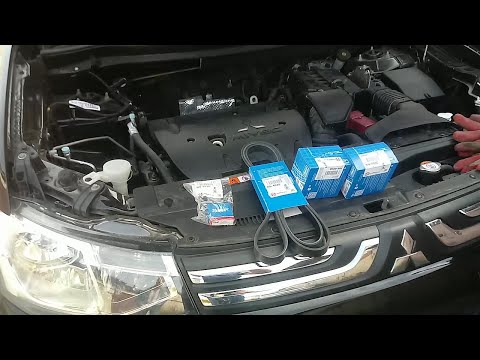 Видео: Mitsubishi Outlander 3 - 2L Замена приводного ремня с роликами.