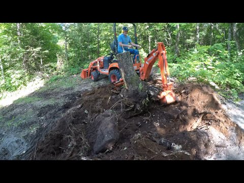 Видео: 578 Большая мощность. Маленький трактор. Копает пни. Компактный трактор Kubota BX23S. Экскаватор-...