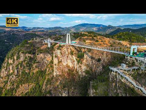 Видео: Знаменитая буддийская гора Китая: осмелитесь ли вы бросить вызов этому подвесному стеклянному мосту?