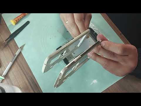 Видео: Как заменить дисплей на телефоне Samsung Galaxy Grand 2 SM-G7102