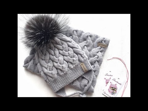 Видео: Шапка с косами спицами