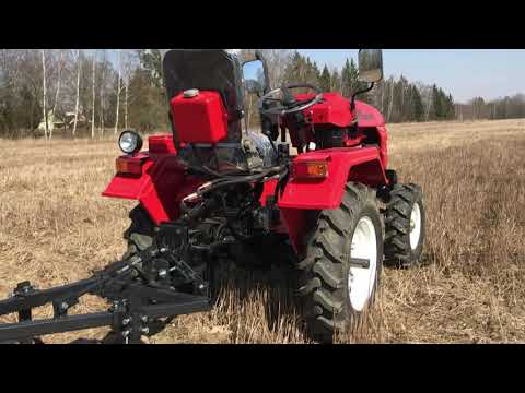 Видео: Обзор мини-трактора ROSSEL XT-184D. Работа с плугом, фрезой.