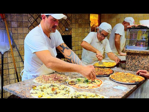Видео: Мастера традиционной римской пиццы в этой исторической пиццерии в районе Тестаччо в Риме