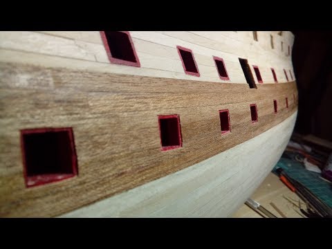 Видео: 57. Покраска портов и приклейка чистовой обшивки. Повелитель морей от деагостини.
