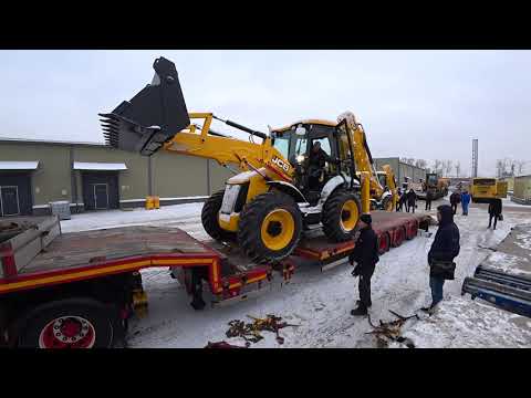 Видео: Перевозка экскаватора-погрузчика JCB на трале.