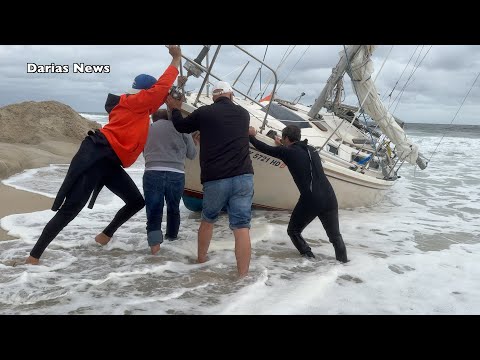 Видео: Парусник сел на мель в Си-Гирте, Нью-Джерси. Срочная гонка против прибрежного шторма у побережья ...