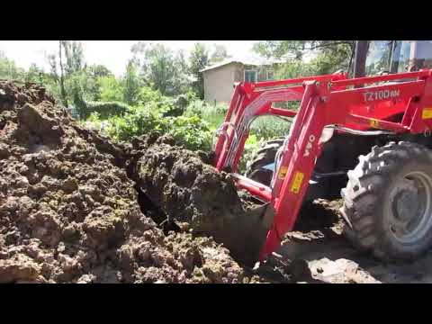 Видео: Трактор YTO -904 работа с погрузчиком