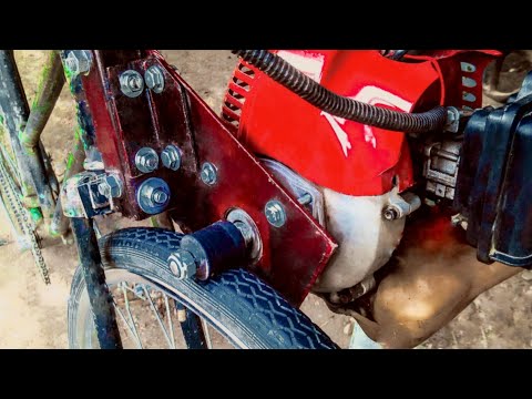 Видео: Мотор от триммера на велосипед, фрикционный привод