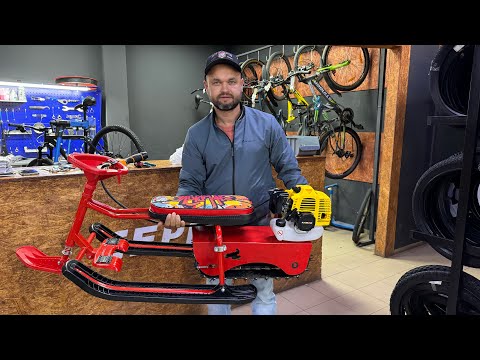 Видео: Сборка бензиновой приставки Снежок