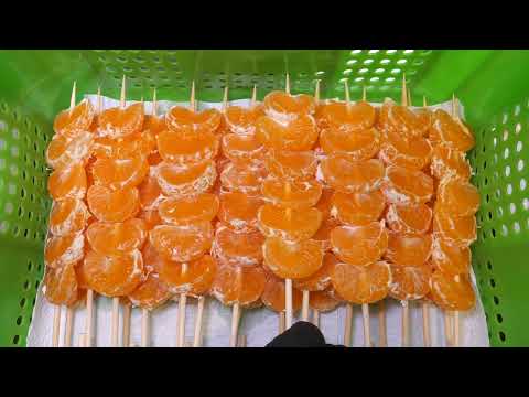 Видео: Процесс изготовления сочных хрустящих фруктовых конфет Танхулу Корейская уличная еда