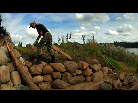 Видео: Стена из валунов - сухая кладка